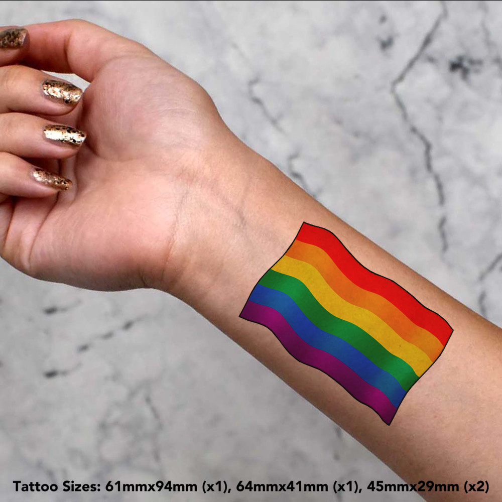 Woman with an lgtb flag and a gay pride tattoo on her chest stock photo